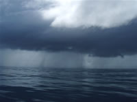 Sometimes a shower at sea was a pleasant cooler in the open banana boat.